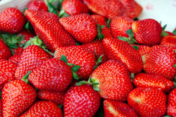 istock Red ripe, appetizing strawberry closeup as background. 1156319910