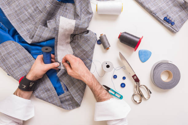 istock Male tailor hands during man's suit manufacturing 1156323120