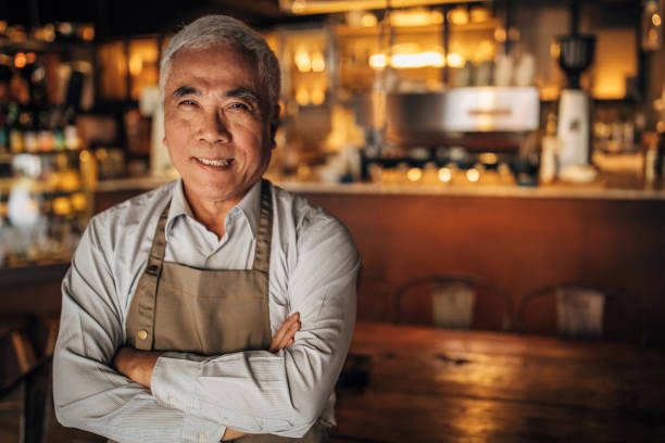 istock Senior cafe owner portrait 1156324034