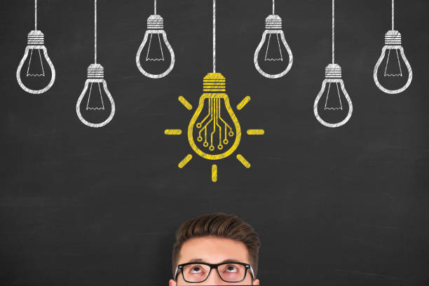 istock Innovative idea concepts with light bulbs on a chalkboard background 1156327878