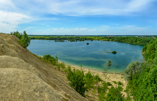 Quarries for the extraction of limestone. The embankment formed by piles of small crushed stone from limestone.