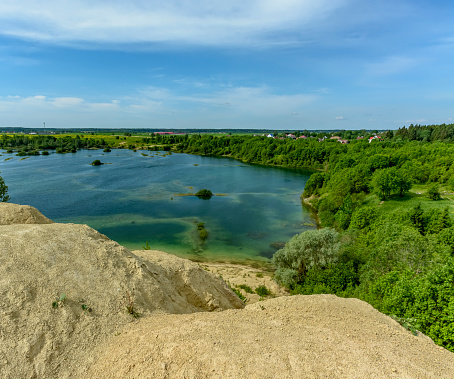 Quarries for the extraction of limestone. The embankment formed by piles of small crushed stone from limestone.