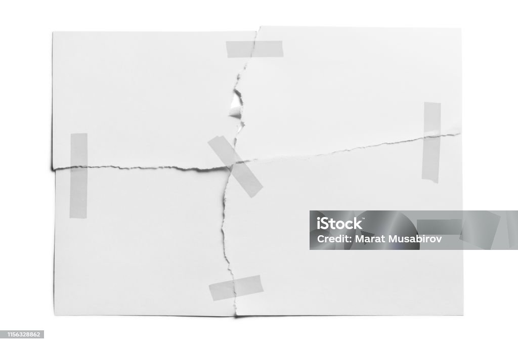 Torn sheet of paper glued with adhesive tape Torn sheet of paper glued with adhesive tape, isolated on white background Paper Stock Photo