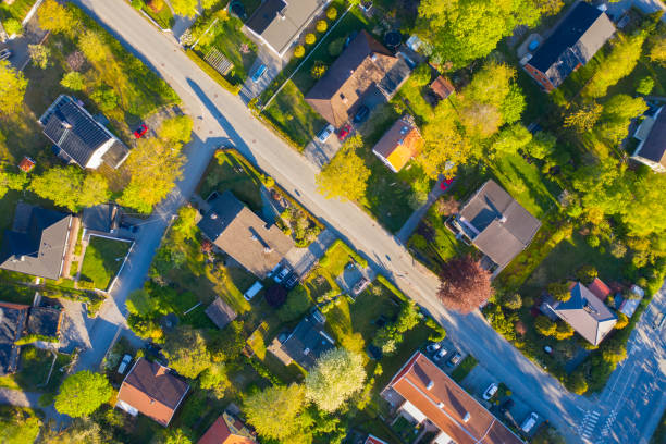 istock Top view, flying over idyllic villa area early morning 1156330059