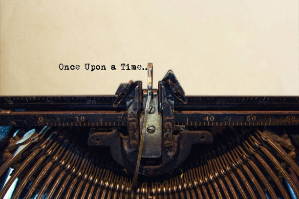 пишущая машинка набрав из once upon время - typewriter storytelling fairy tale book стоковые фото и изображения