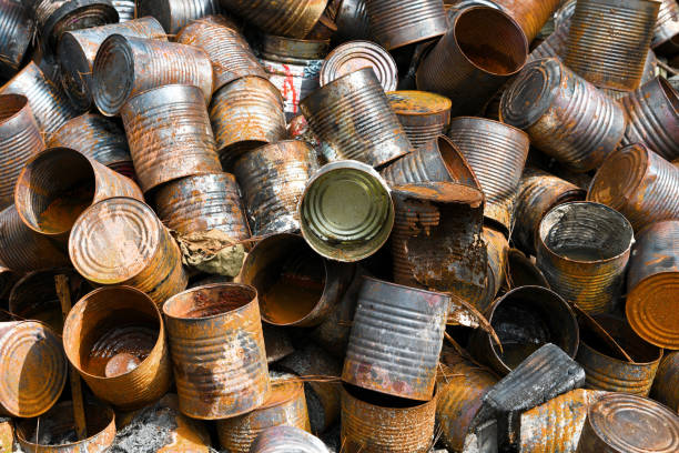 A pile of metal cans and other items at an Illegal Dump Site