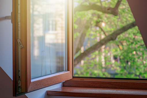 ventana abierta con marco de madera, casa acogedora photo