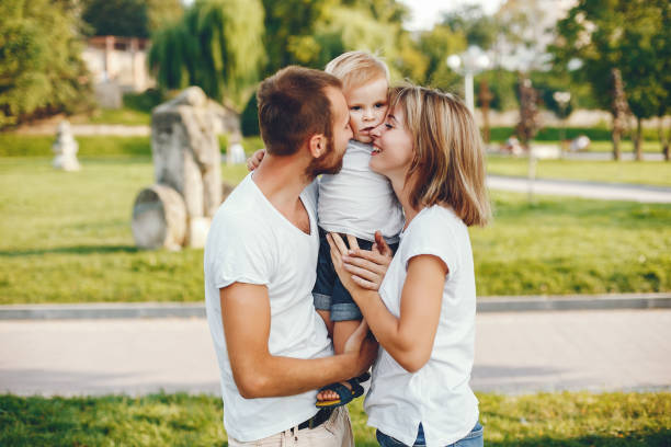 istock Family with son playing in a summer park 1156336607