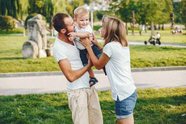 istock Family with son playing in a summer park 1156336671