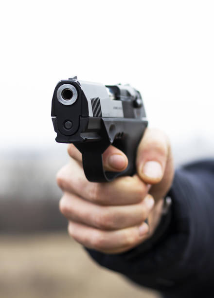 istock Gun in hand closeup 1156336728
