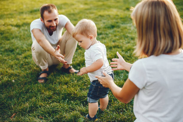 istock Family with son playing in a summer park 1156337389