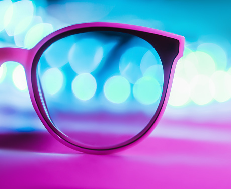 Isolated sunglasses with colorful reflections copy space