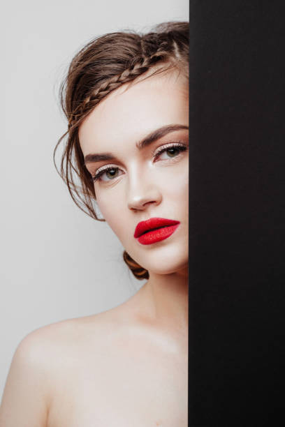 istock Close up young gorgeous woman with red lips 1156337511