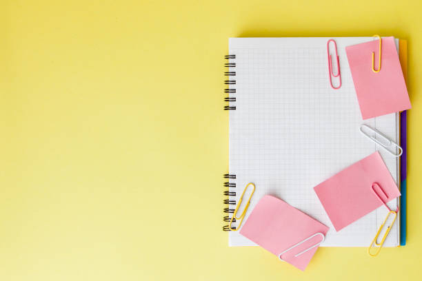 istock Back to school concept with space for text. Top view. Copy space. School office supplies.Creative desk with colourful stationery. Colored paper clip.School supplies on yellow background.Office desk 1156339605