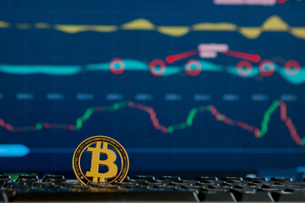 istock Bitcoin gold coin and defocused chart background. Virtual cryptocurrency concept. Bitcoins on ladder chart cryptocurrency concept. Bitcoin currency with blockchain concept 1156339675