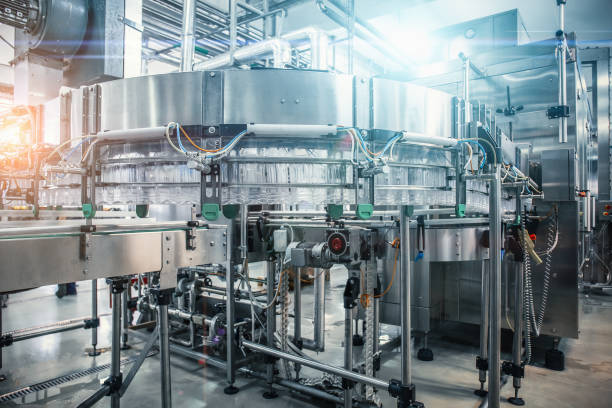 istock Empty plastic bottles move on automatic conveyor line or belt in water and juice factory or plant production 1156340642