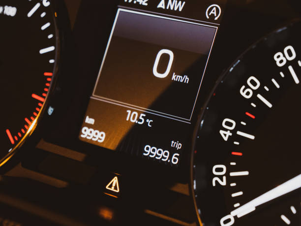 istock Stationary new modern car speedometer dashboard zero speed 9999km 1156341674