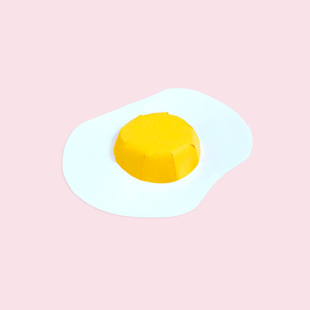 istock Paper egg on peach color background 1156341932