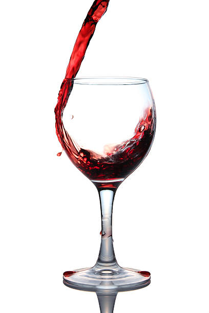 istock red wine pouring into glass isolated 115634267