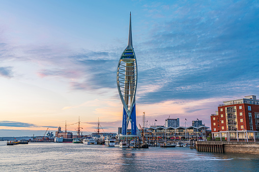 This is an evening view of the famous Spinnaker Tower skyscraper building along the waterfront on May 25, 2019 in Portsmouth