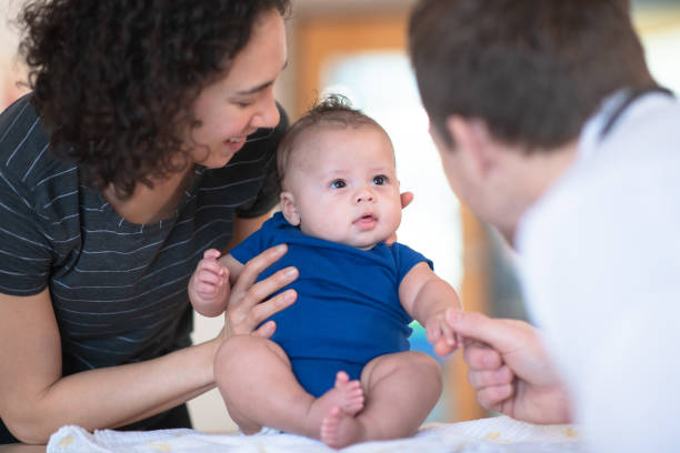istock Mother holding her toddler 1156350117