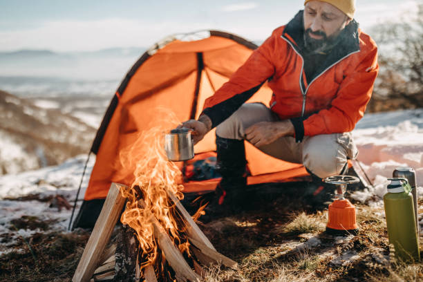 istock Man preparing food on mountain 1156350269