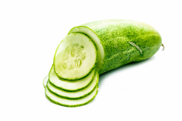 istock Raw cut sliced cucumber isolated on white. 1156350914