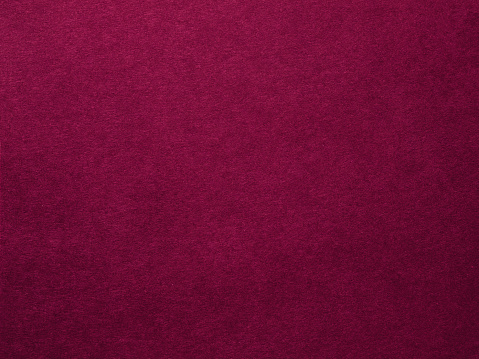 Plum purple felt texture abstract art background. Colored fabric fibers surface. Empty space.
