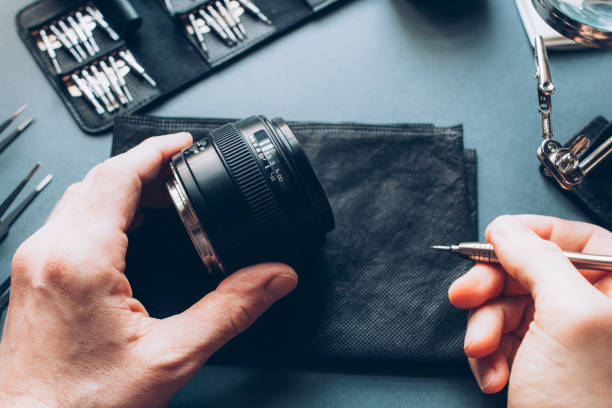 istock tech maintenance support photo camera lens repair 1156351382