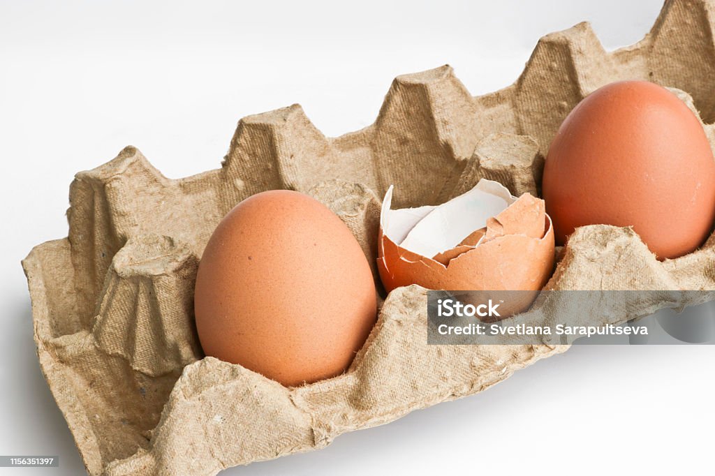 Packaging Using Eggshell Carton Packaging For Eggs With Broken Eggshell And Eggs On A Light ...