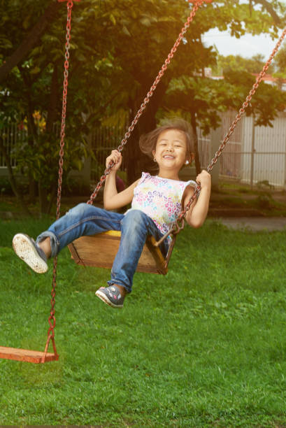 istock Asian kid in playground 1156356297