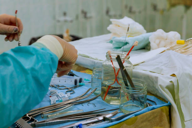 istock Nurse preparing medical instruments for operation 1156360374