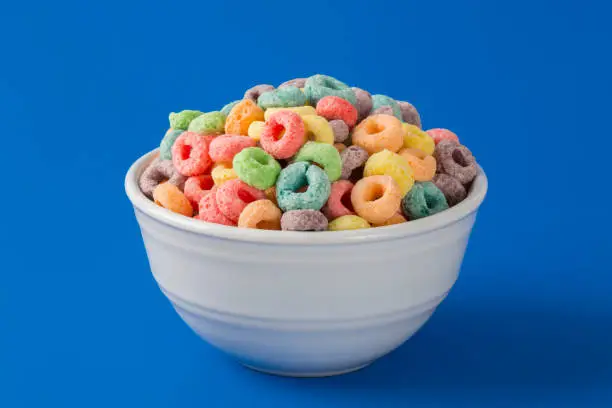 Colorful Fruity Cereal on a Blue Background