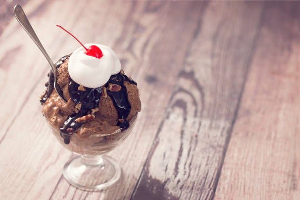 istock Ice Cream in a Dish with a Spoon 1156361081