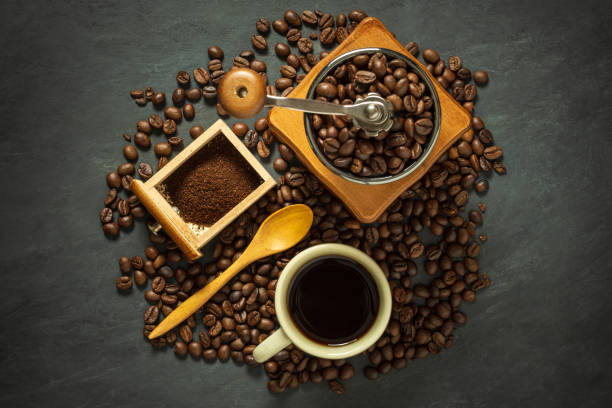 istock Coffee cup and coffee equipment on black cement floor. 1156361247