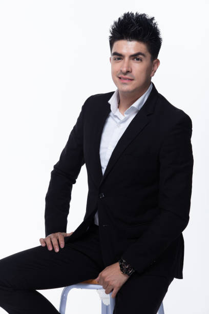 istock Business Man Stand in dark Black proper Suit 1156369508