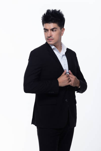 istock Business Man Stand in dark Black proper Suit 1156369511