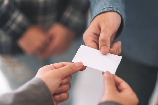 istock businessman holding and exchanging empty business card 1156370081