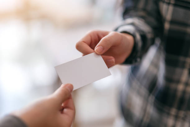 istock businessman holding and exchanging empty business card 1156370137