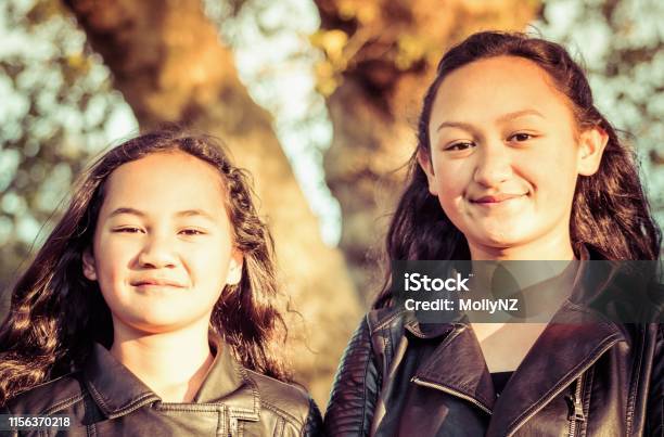 Portrait Of Two Young Maori Sisters Stock Photo - Download Image Now - New Zealand, Pacific Islanders, Child