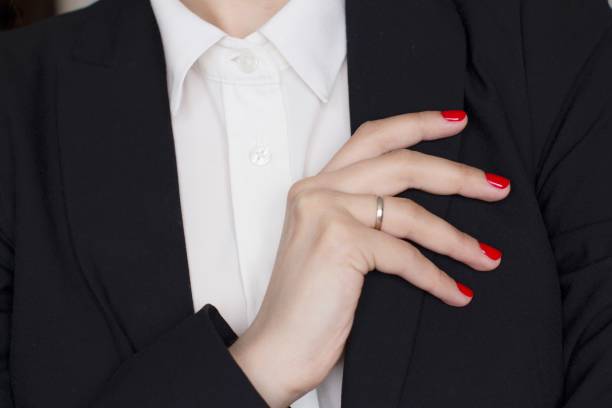 istock young woman in black a suit 1156370372
