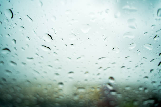 istock Rain drops on the windshield In the evening when heavy rain 1156372159