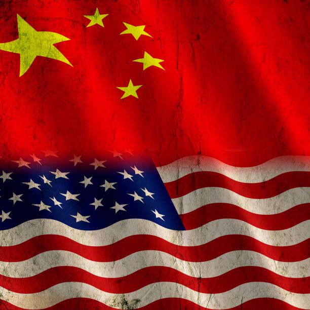 istock China and USA flag background 1156374248