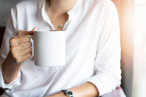 istock Take a break concept.  Hand holding cup of coffee 1156375860