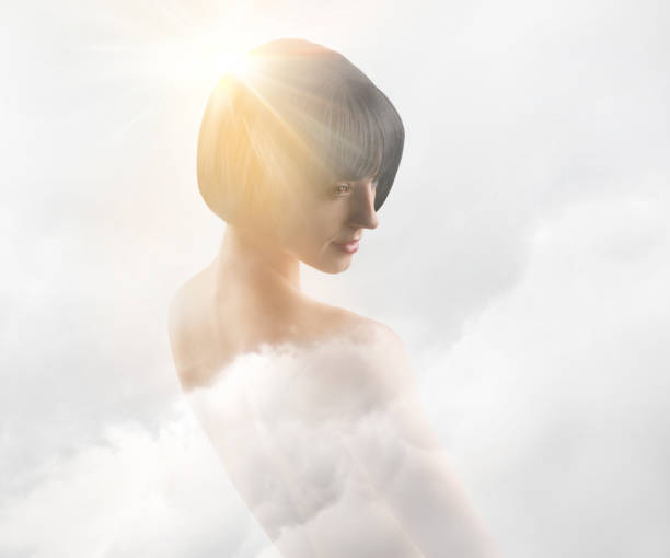 istock Multiple Exposure of serene young woman and clouds 1156375908