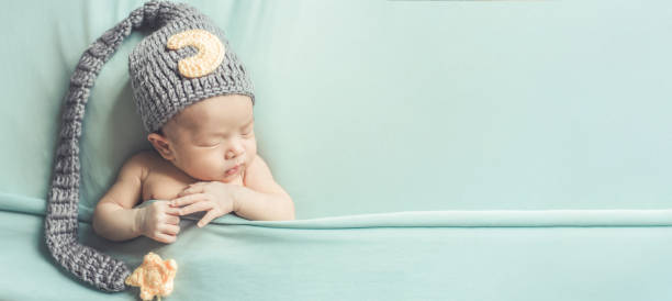 istock Adorable newborn baby sleeping in cozy room. 1156386834