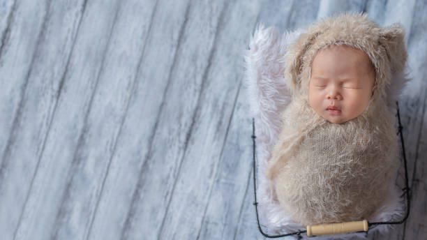 istock Adorable newborn baby sleeping in cozy room. 1156386844