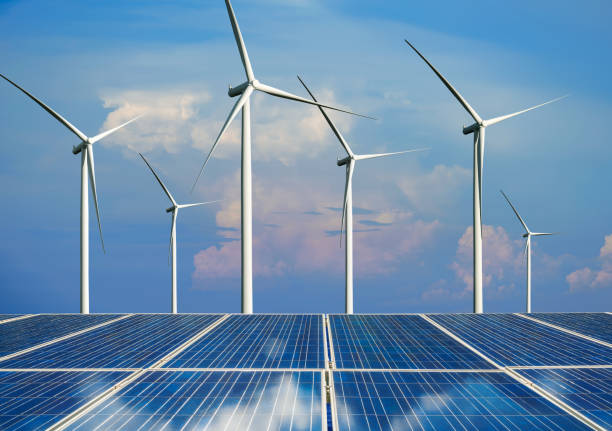 istock Solar panel and wind turbine farm clean energy. 1156386848
