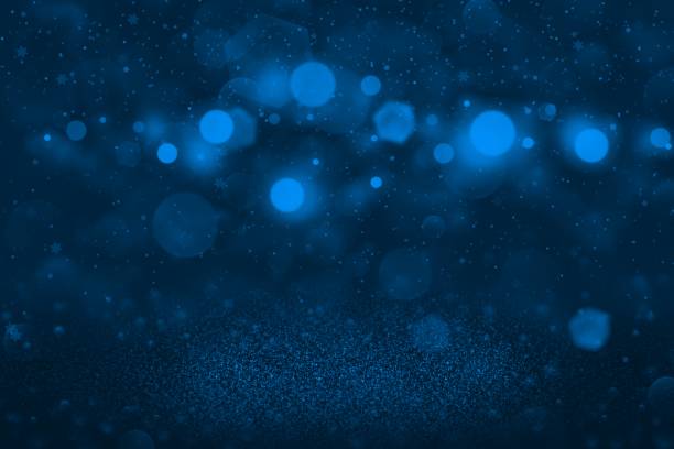 istock blue pretty shining glitter lights defocused bokeh abstract background with falling snow flakes fly, holiday mockup texture with blank space for your content 1156390886