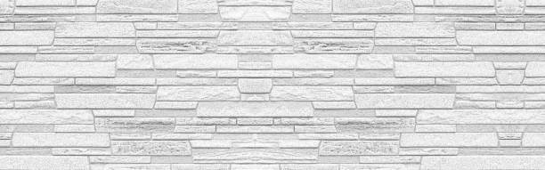 istock Panorama of white modern stone wall pattern and background 1156391828